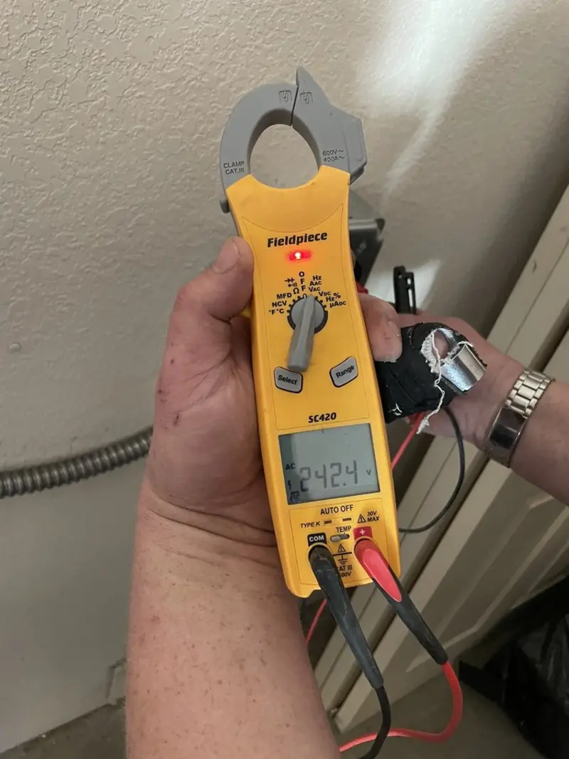 Voltage testing with clamp meter during Circuit Breaker Repair in Homeland Park